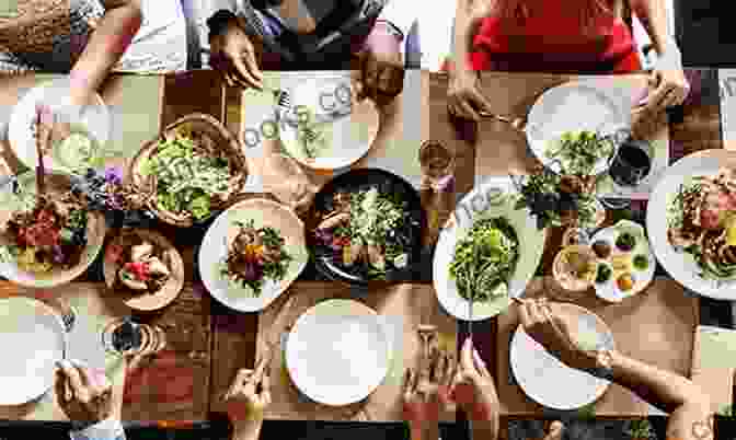 A Group Of People Sharing A Meal At A Long Table, Symbolizing The Legacy Of Forest City Cookbook Alieska Robles