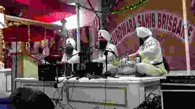 A Sikh Man Performing Kirtan, A Form Of Devotional Music SIKHISM AT A GLANCE: The Sikhs And Their Religion